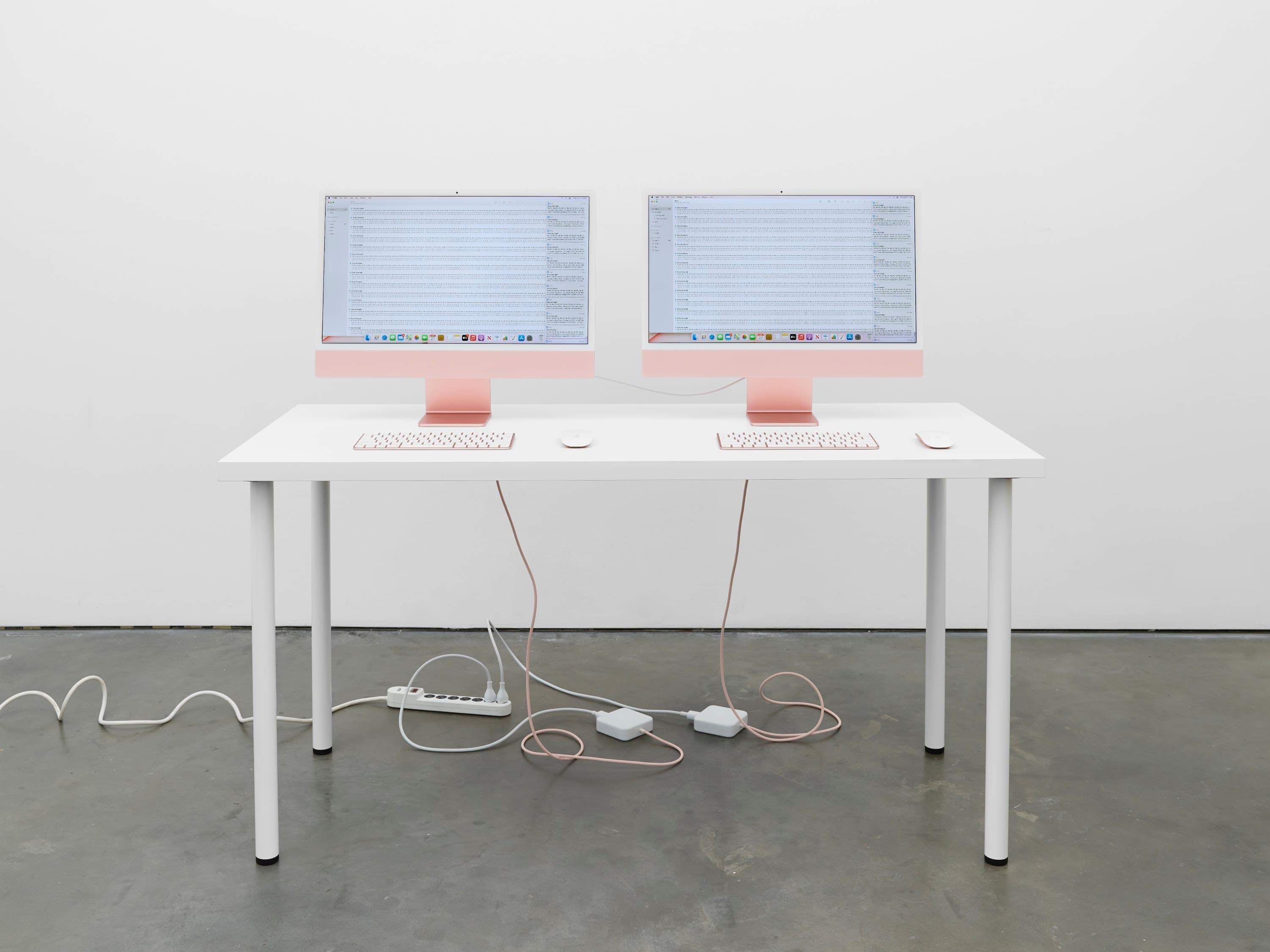 Cory Arcangel, “Permanent Vacation,” 2021. (x2) 24-inch Pink iMac with 4.5K Retina display, Thunderbolt 3 (USB-C) cable (0.8 m), (x2) Apple Magic Mouse, (x2) Apple Magic Keyboard, SMTP server software, DNS server software. Dimensions variable. © Cory Arcangel, courtesy of the artist and Lisson Gallery.